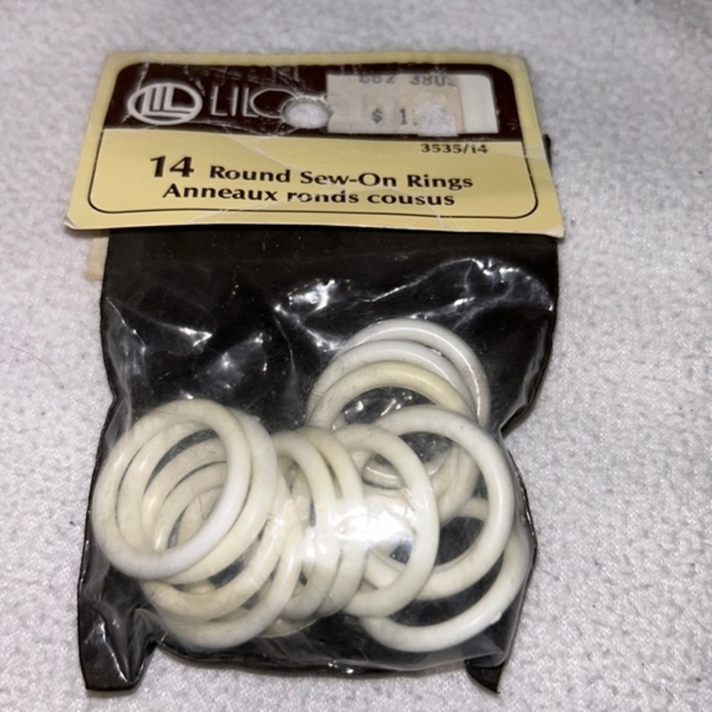 Vintage plastic sew-on rings 14 total new old stock